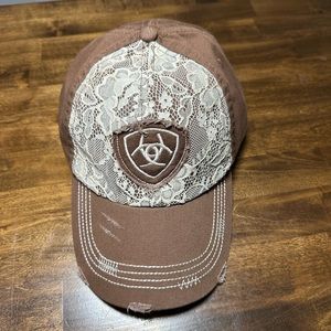 Brand new without tags Ariat hat. Brown with cream colored lace.